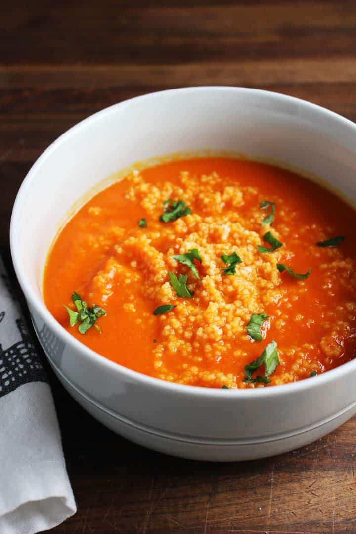 This beautiful, bold soup gets a ton of flavor from harissa, and is extra satisfying on a chilly fall evening with the amazing addition of a couscous swirl.