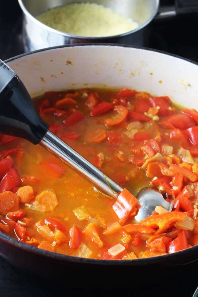 This red pepper carrot soup gets a ton of flavor from harissa, and is extra satisfying on a chilly fall evening with the amazing addition of a couscous swirl.