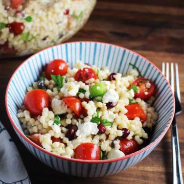 A serving of mediterranean Israeli couscous salad in a bowl