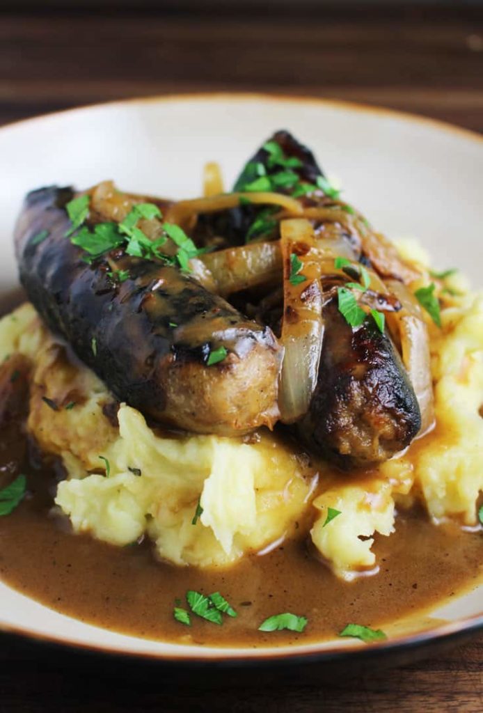Bangers and mash recipe with gravy, in a bowl
