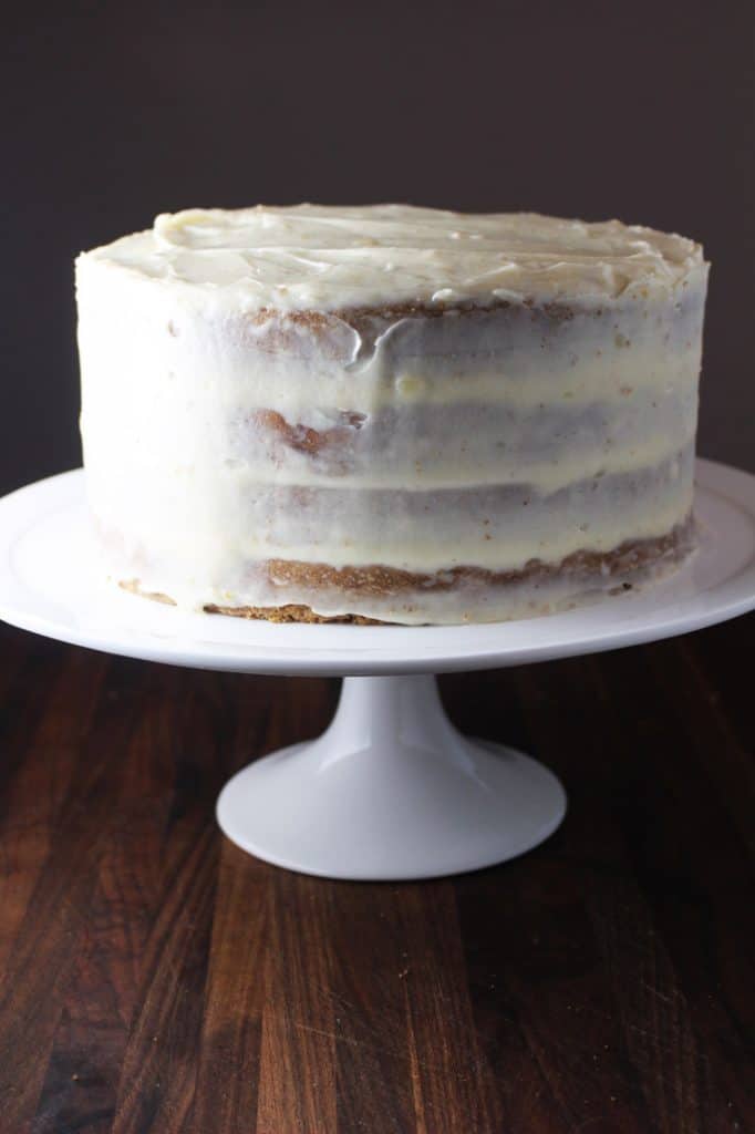 Frosted moist carrot cake on a stand