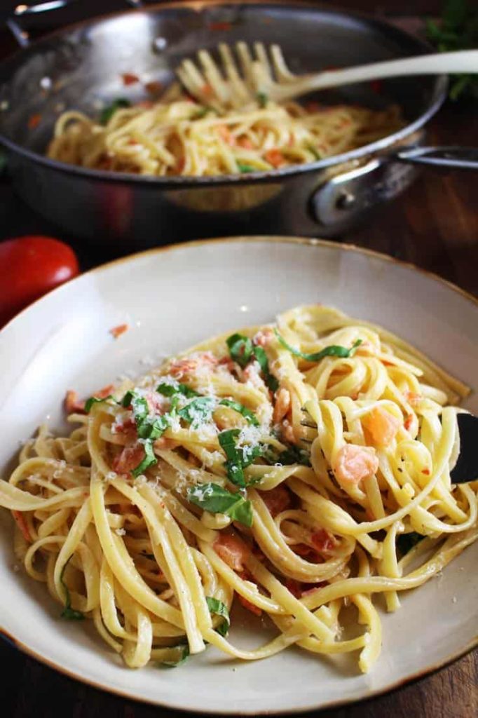 Linguine with fresh tomato cream sauce in a bowl