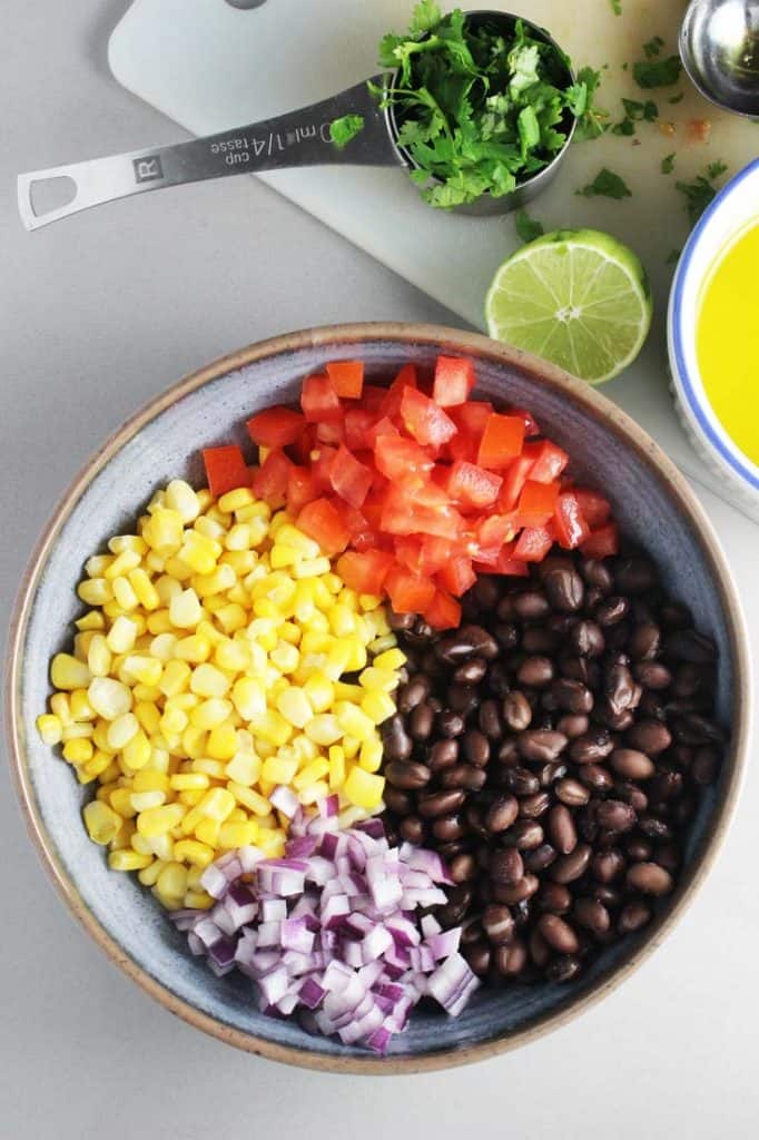ingredients for black bean and corn salsa in a bowl for blackened fish taco recipe