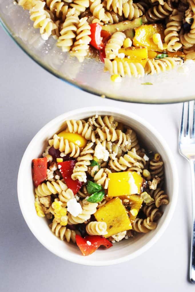 Summer pasta salad with grilled vegetables in a bowl
