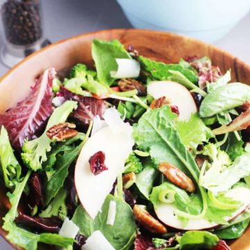 Fall salad with maple dressing in a wooden bowl