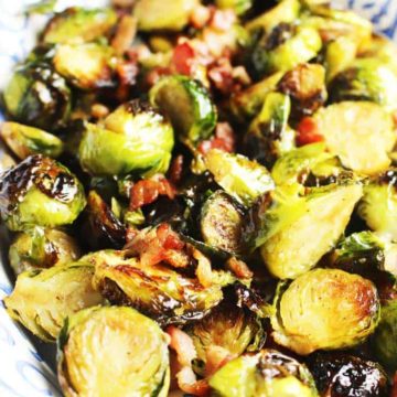 Roasted Brussels Sprouts with maple syrup, balsamic vinegar and bacon in a serving dish