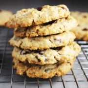 A stack of oatmeal chocolate chip cookies with peanut butter on a cooling rack