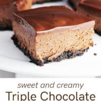 A triple chocolate cheesecake bar on a white plate with more bars in the background