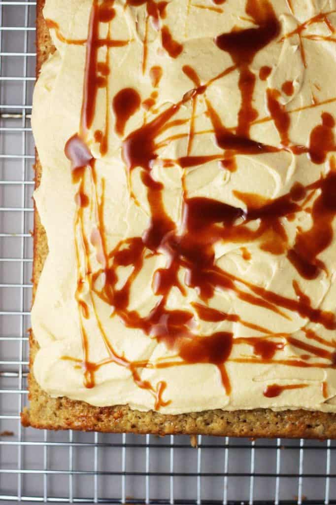Banana caramel cake with caramel frosting, drizzled with caramel