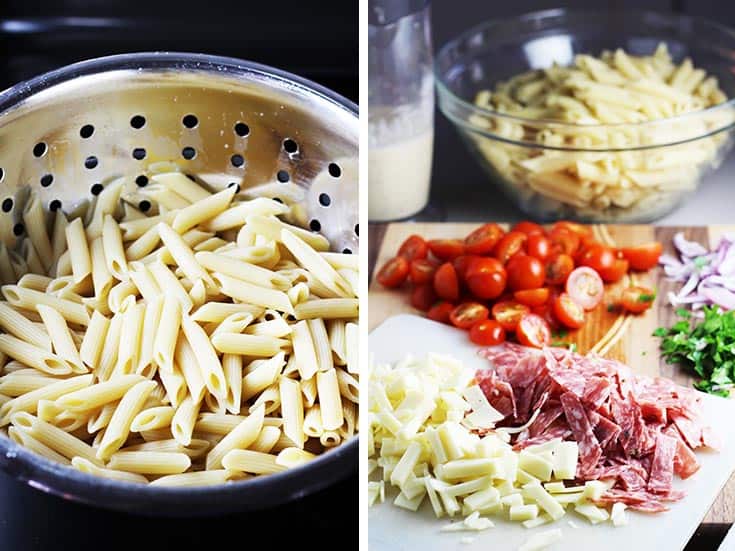 Cooked penne pasta in a colander and chopped salami cheese and tomatoes for Italian pasta salad