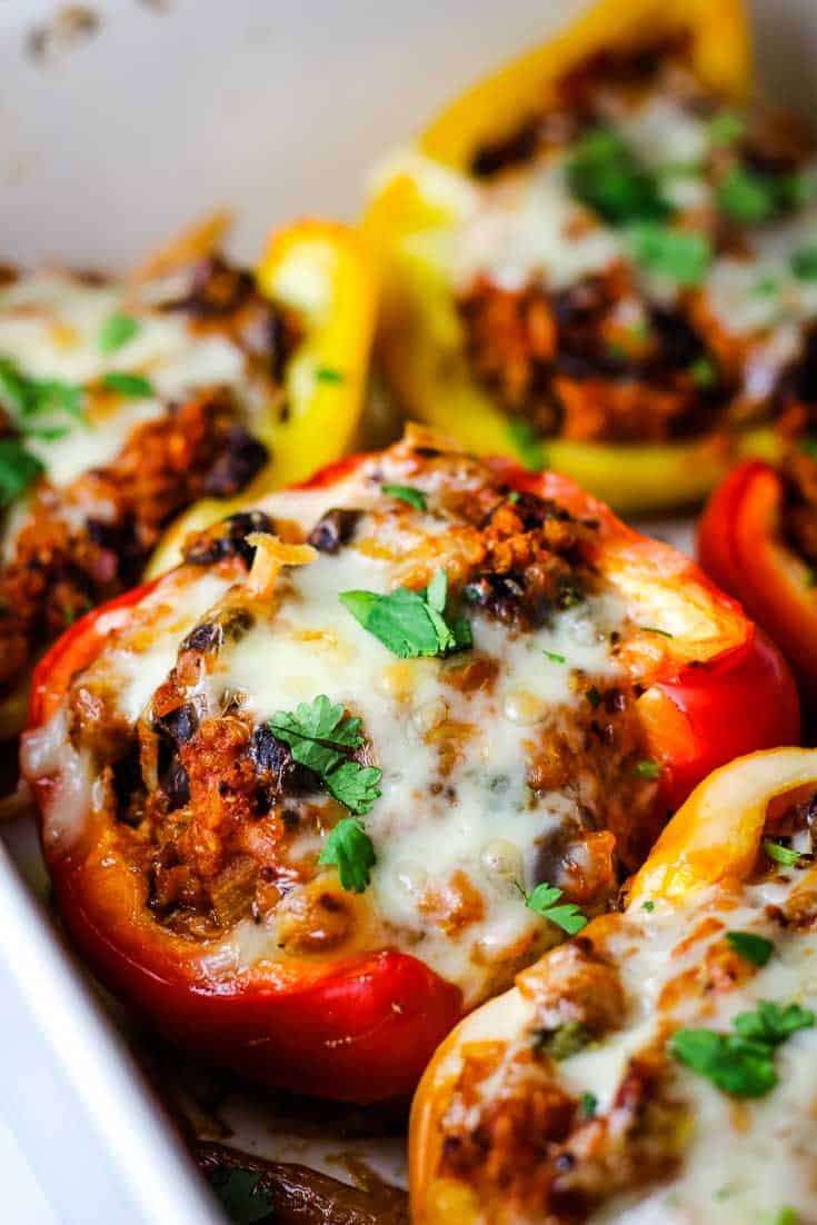 Vegetarian stuffed peppers in a baking dish