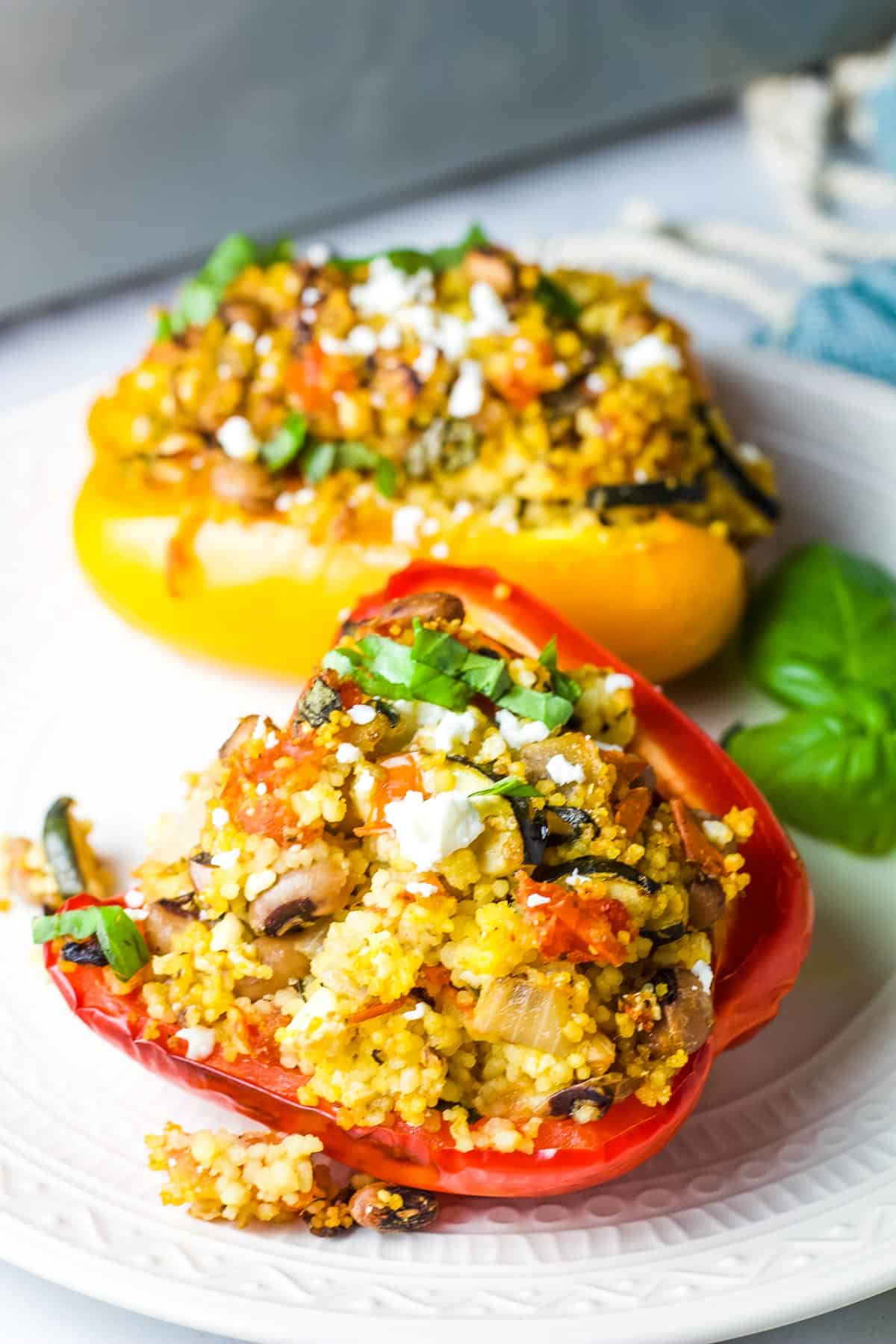 Two stuffed bell pepper halves on a plate