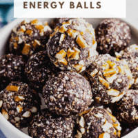 Energy balls piled into a bowl with text overlay