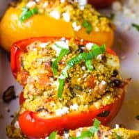 Baked Mediterranean couscous stuffed peppers in a baking dish