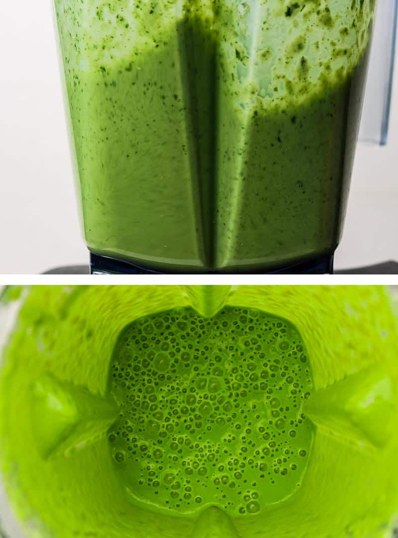 A green smoothie being blended in a high speed blender.