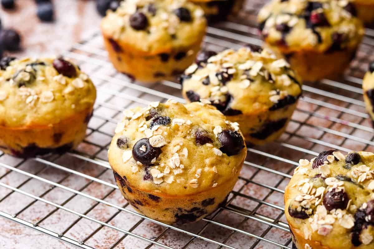 Blueberry banana muffins on a cooling rack.