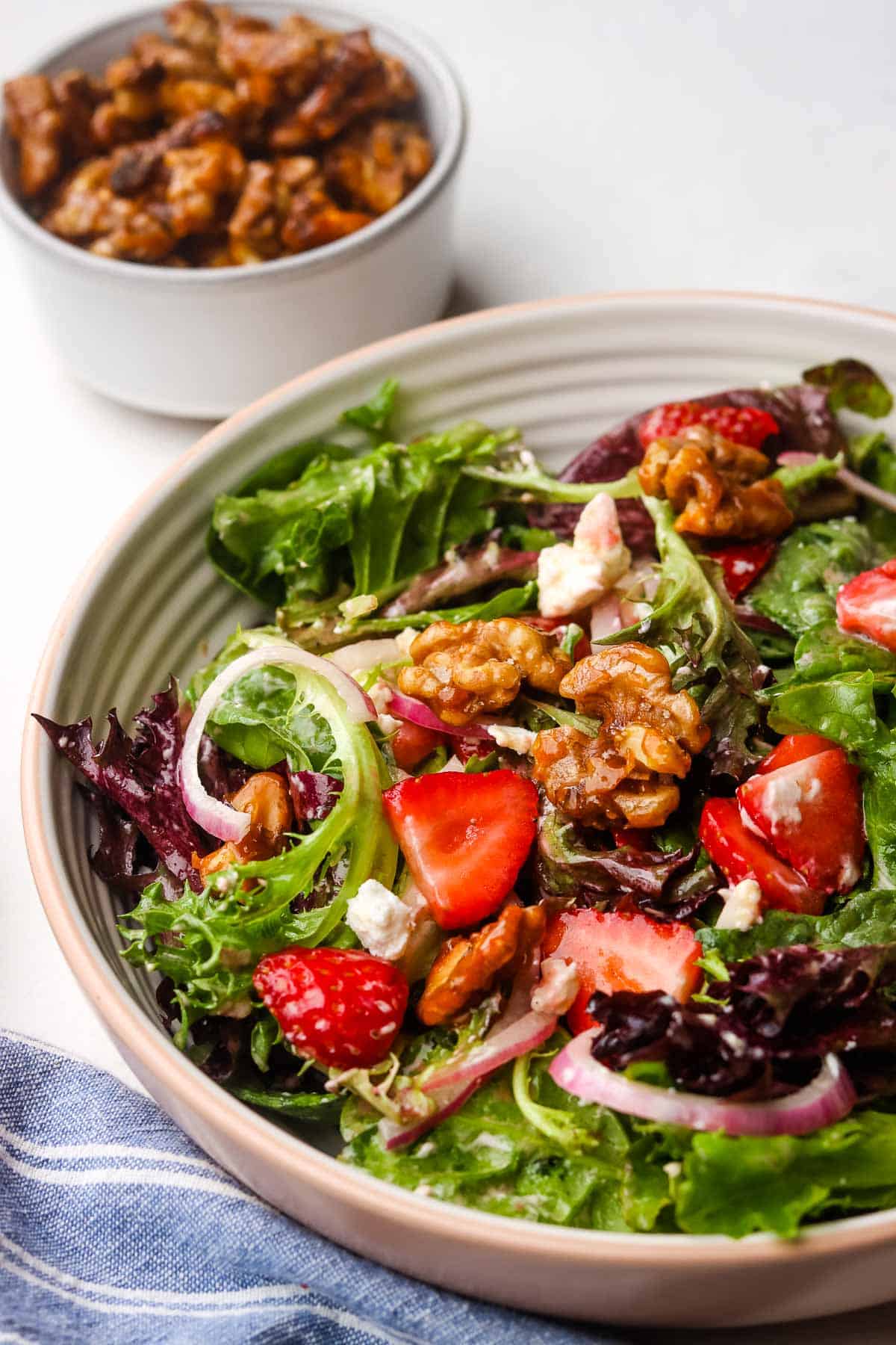 Strawberry goat cheese salad in a bowl.