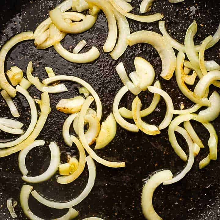 sautéing onions in a pan