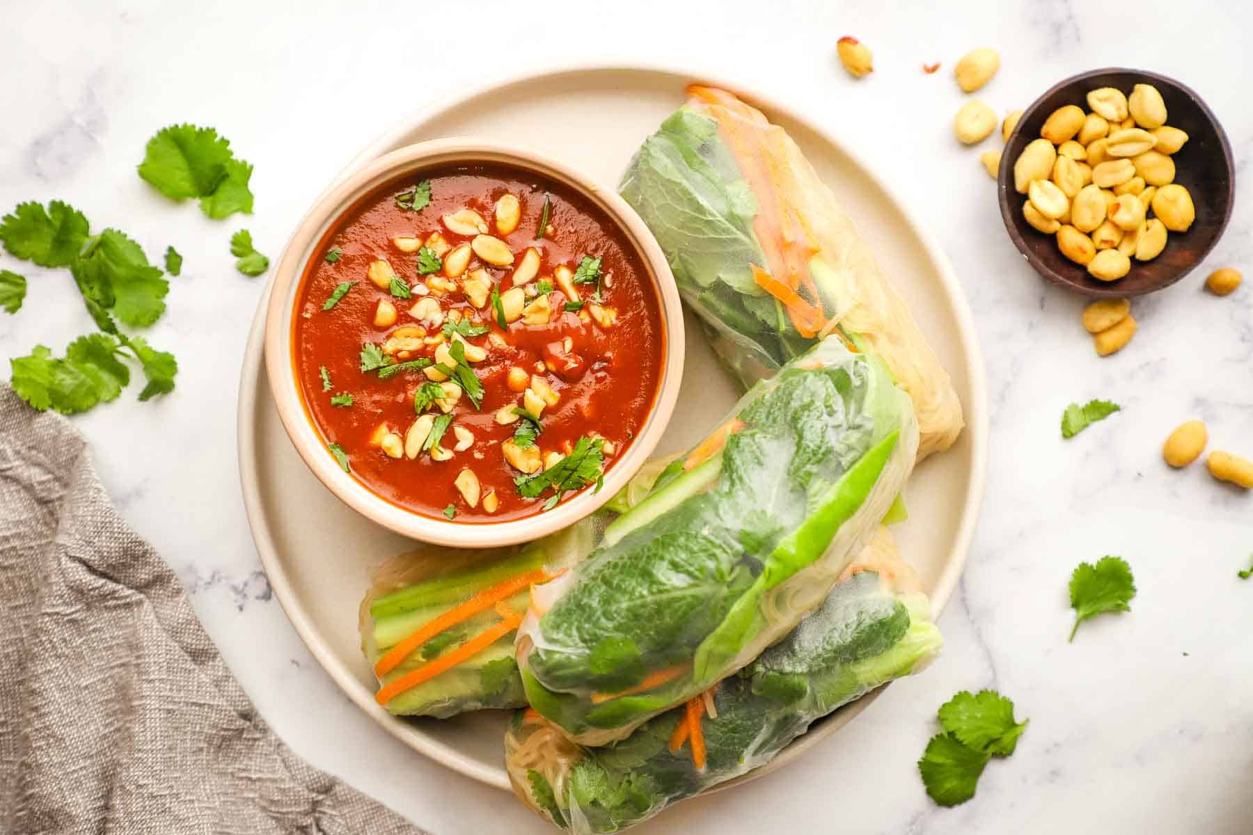 Overhead shot of Tofu summer rolls served with dipping sauce