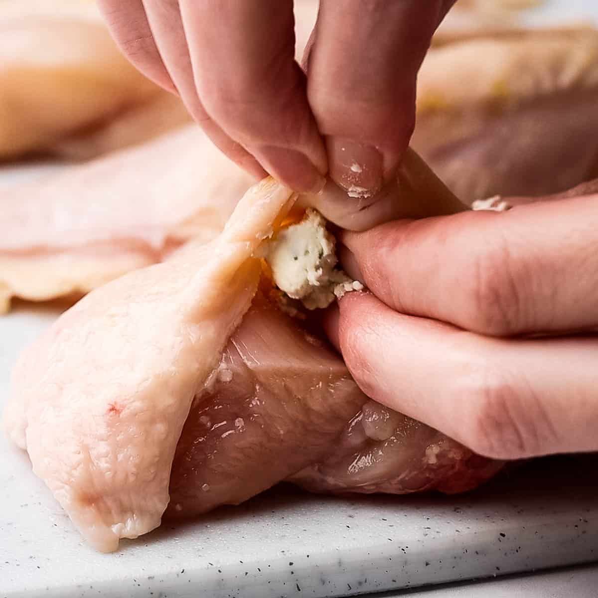stuffing the chicken breast with boursin cheese