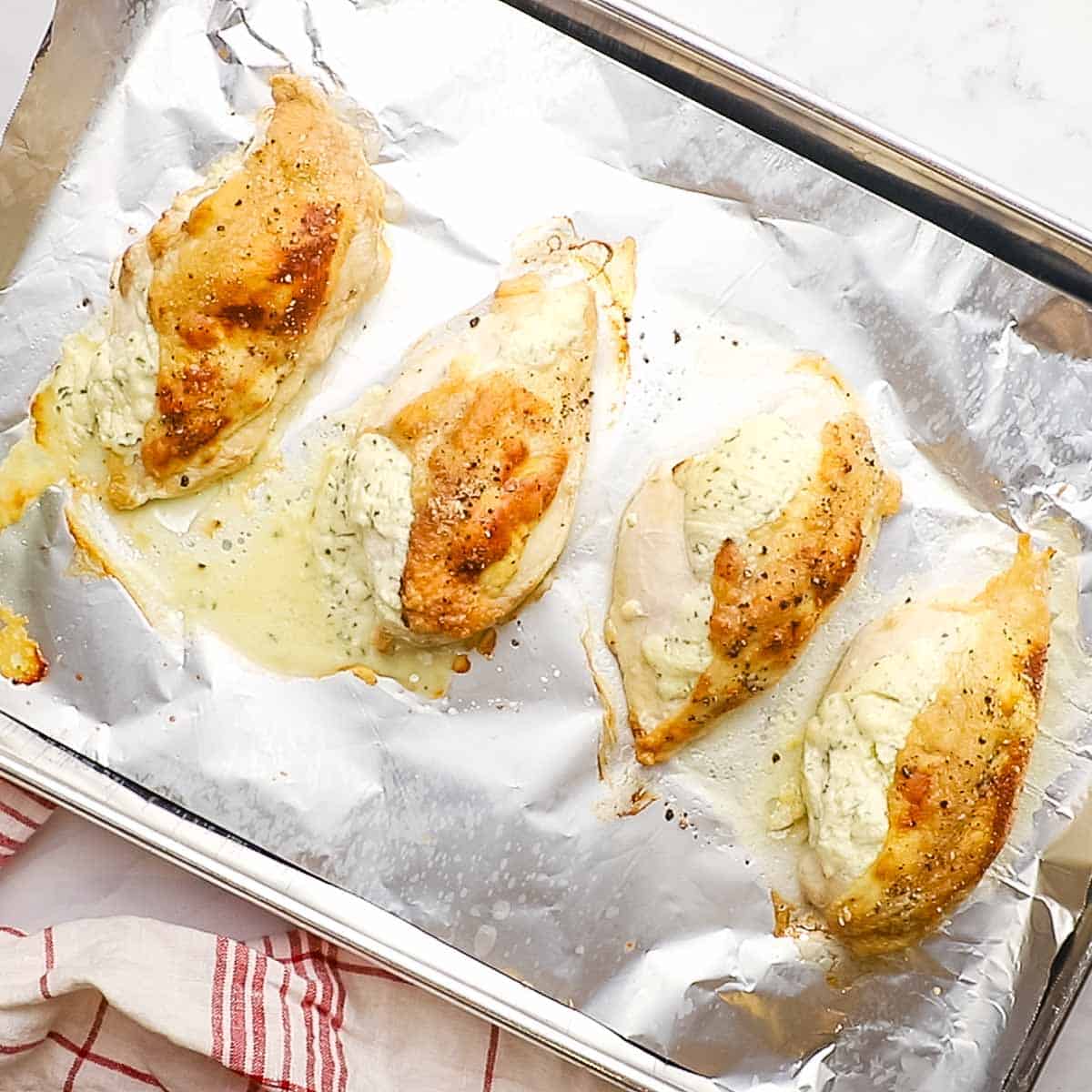 freshly roasted boursin chicken breasts on a baking sheet