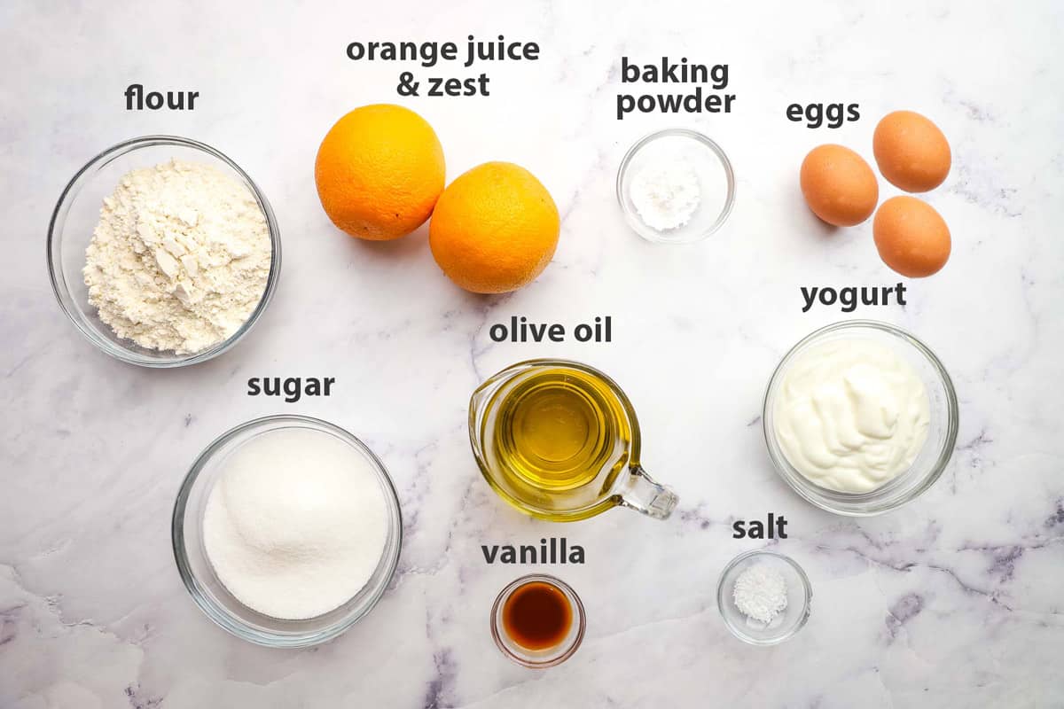 ingredients pictured and labelled for orange loaf cake