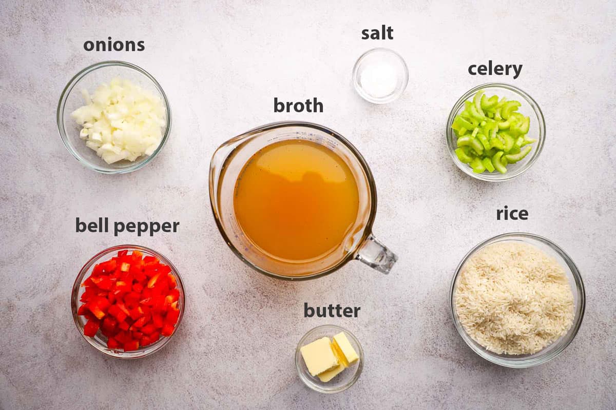 Ingredients to make Cajun rice pilaf portioned into bowls.