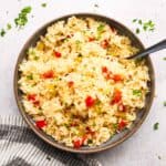 Overhead view of a pan of baked Cajun rice pilaf.