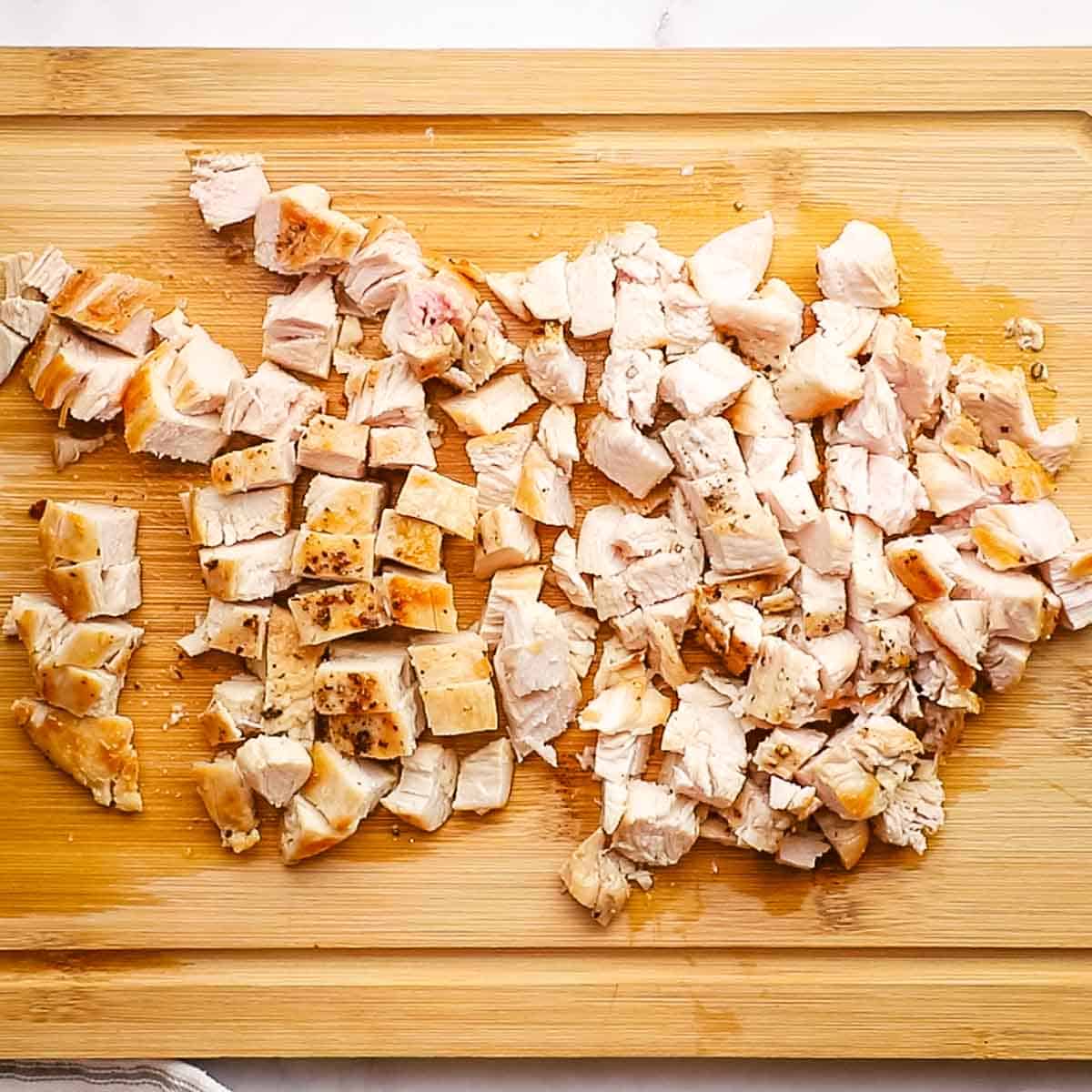 chopped chicken breast on a cutting board