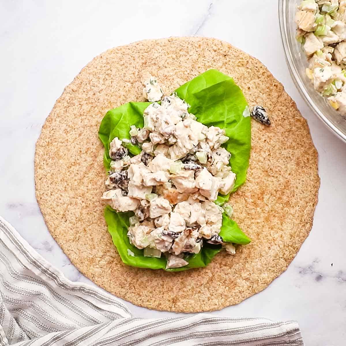 lettuce and chicken on a tortilla