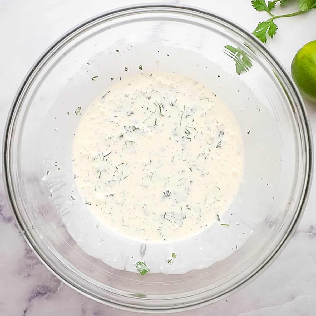 cilantro lime slaw ingredients in a bowl