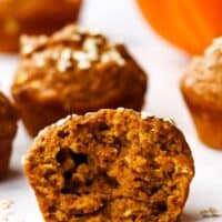 A pumpkin muffin halved to show the inside texture.