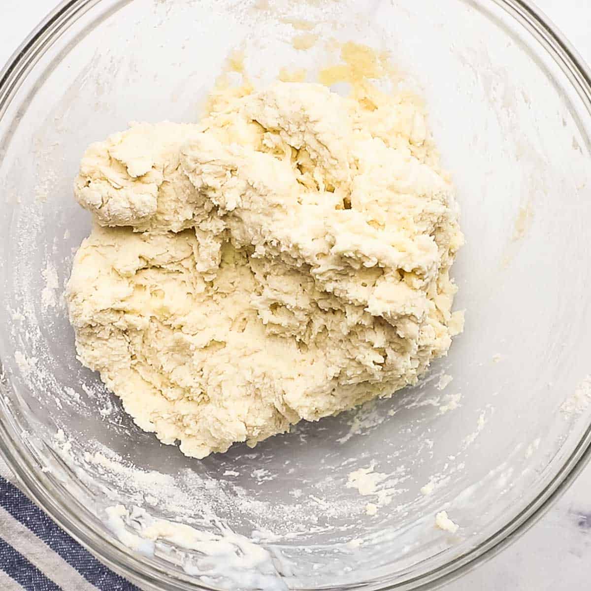 overhead view of biscuit dough in a bowl