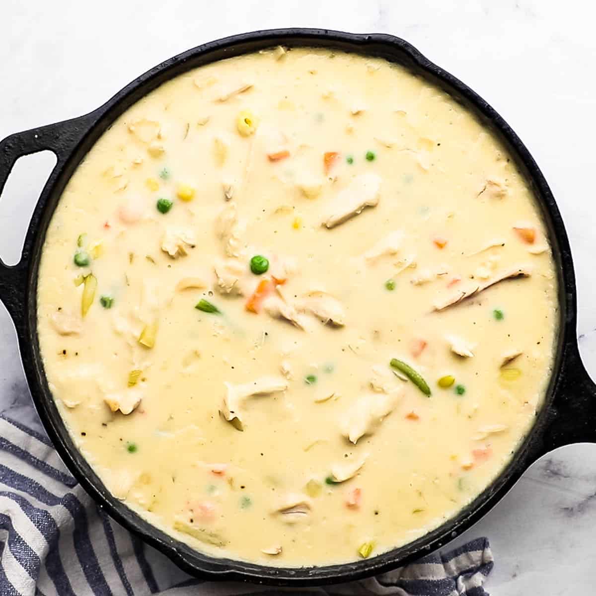 creamy chicken pot pie filling in a skillet