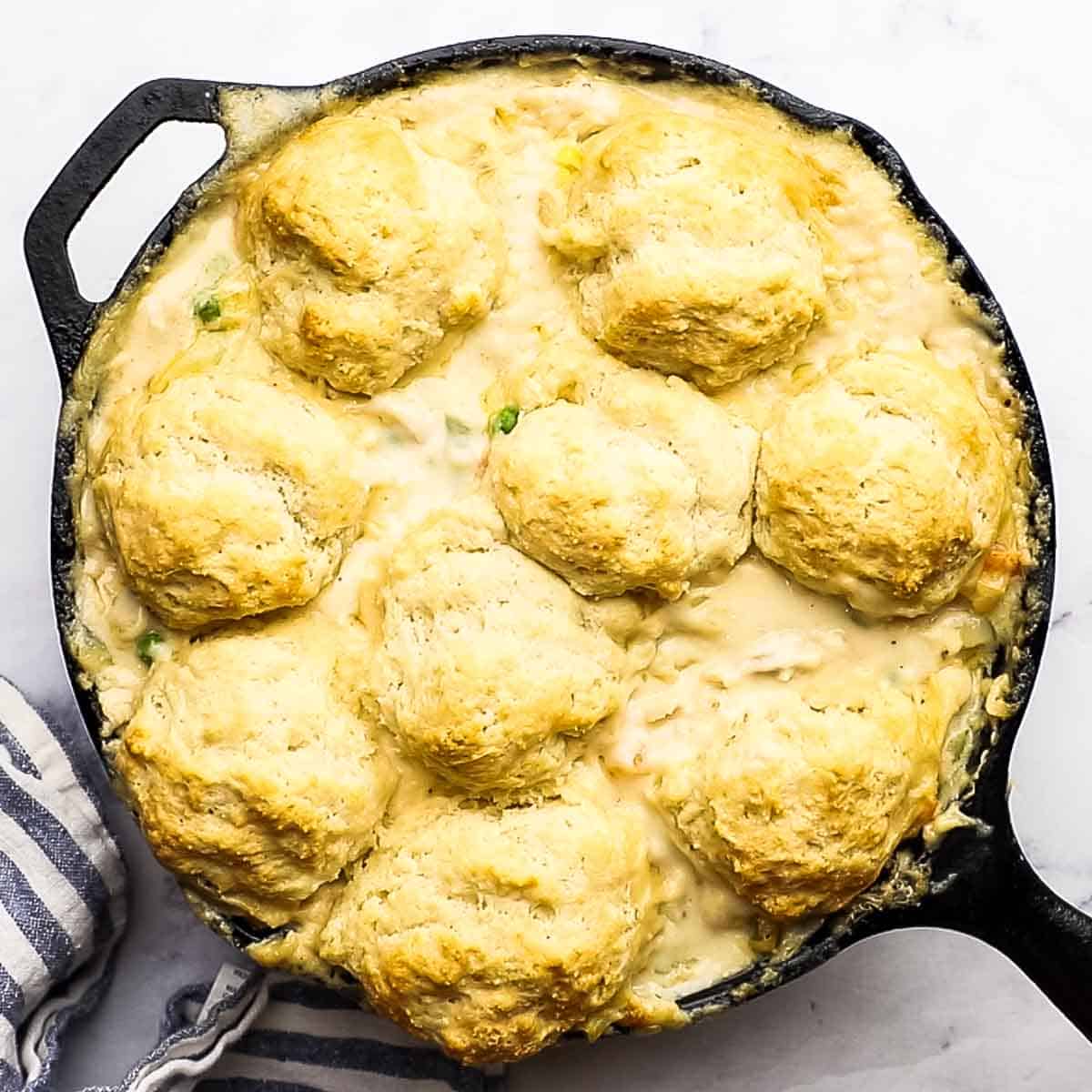 overhead view of freshly baked skillet pot pie with golden brown biscuits on top