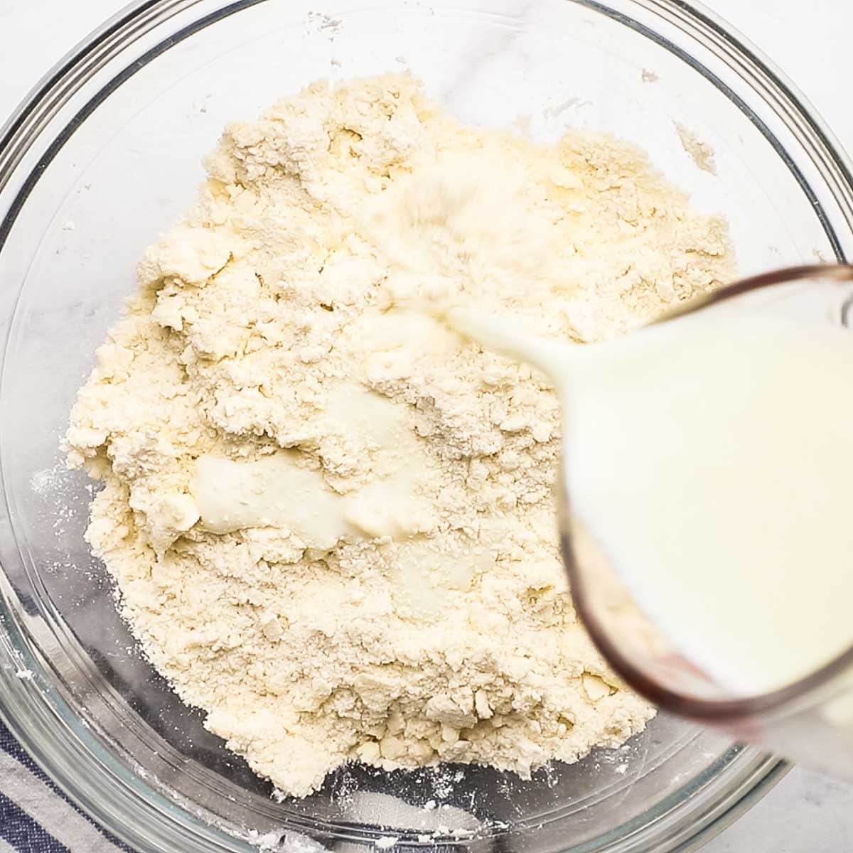 adding buttermilk to the flour mixture