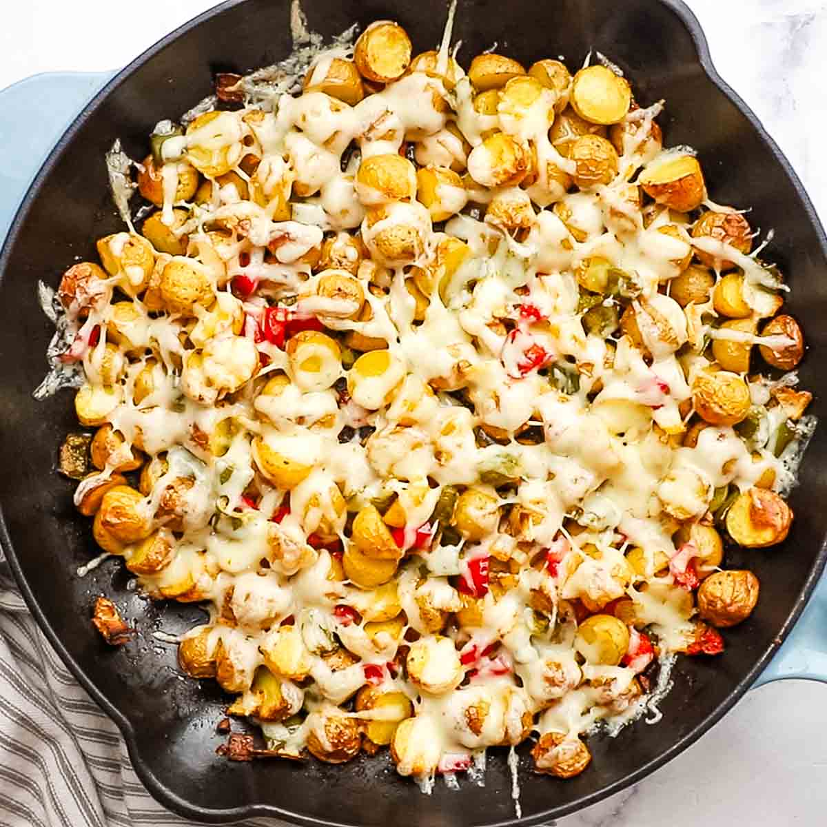 cheesy country potatoes in a skillet