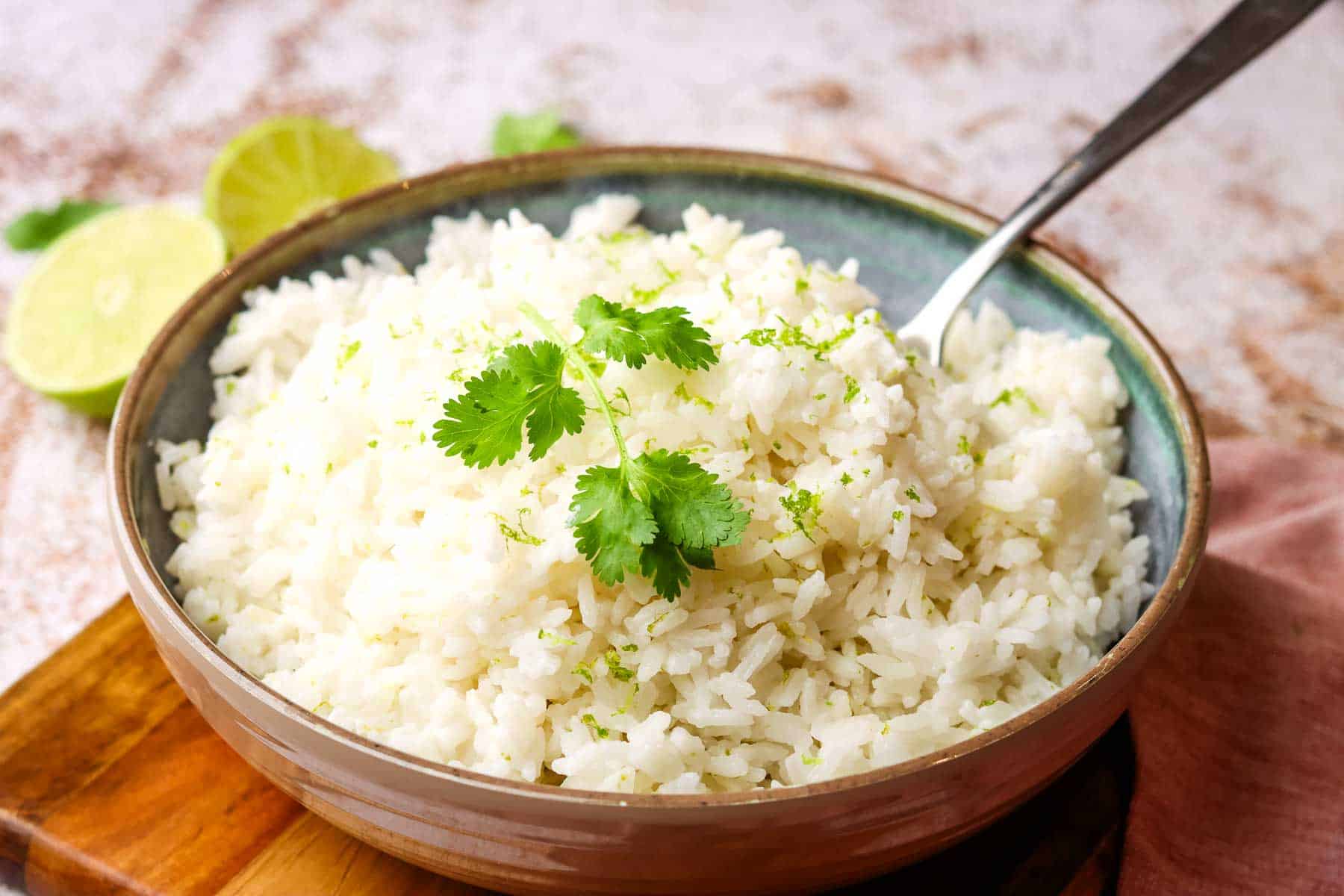 a dish of baked coconut rice topped with cilantro.