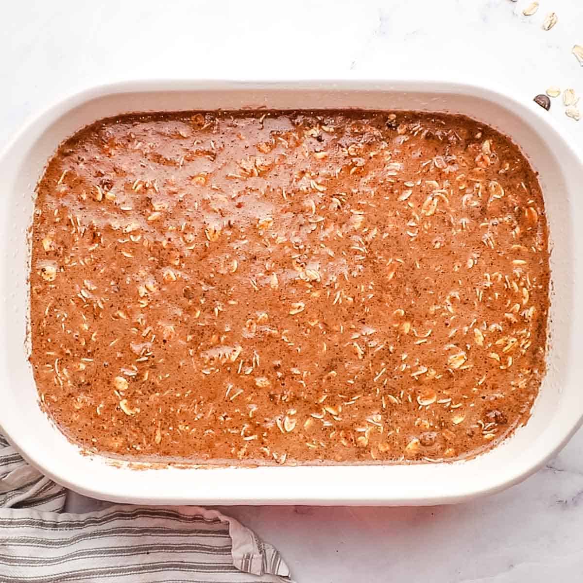 chocolate oats mixture poured in a baking dish