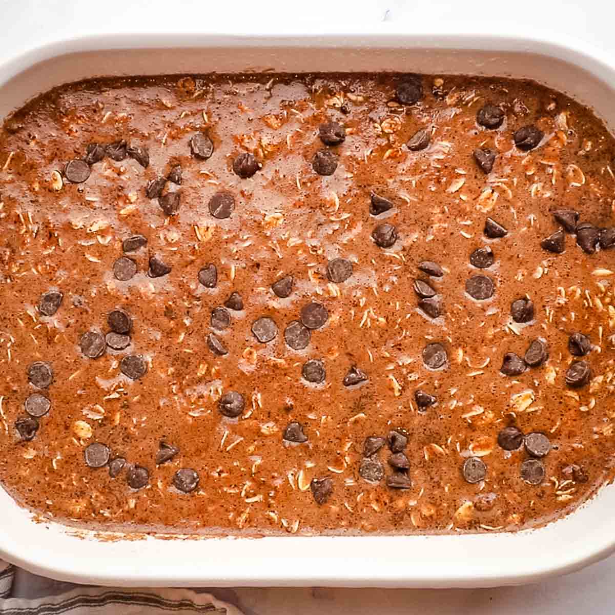 chocolate chips sprinkled on the warm chocolate baked oats