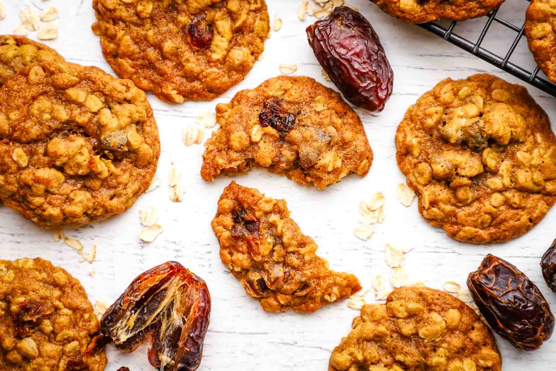 overhead view of oatmeal date cookies with one cookie broken in half