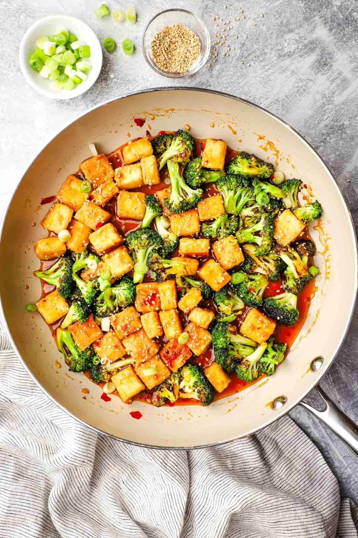 broccoli and tofu added to the pan with the sauce