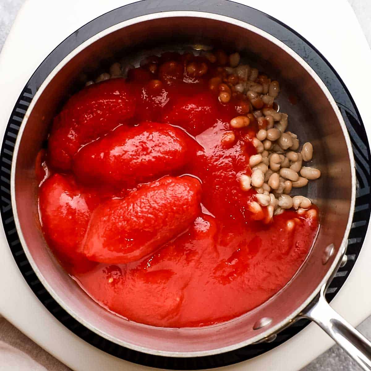 canned tomatoes and bean in a pot