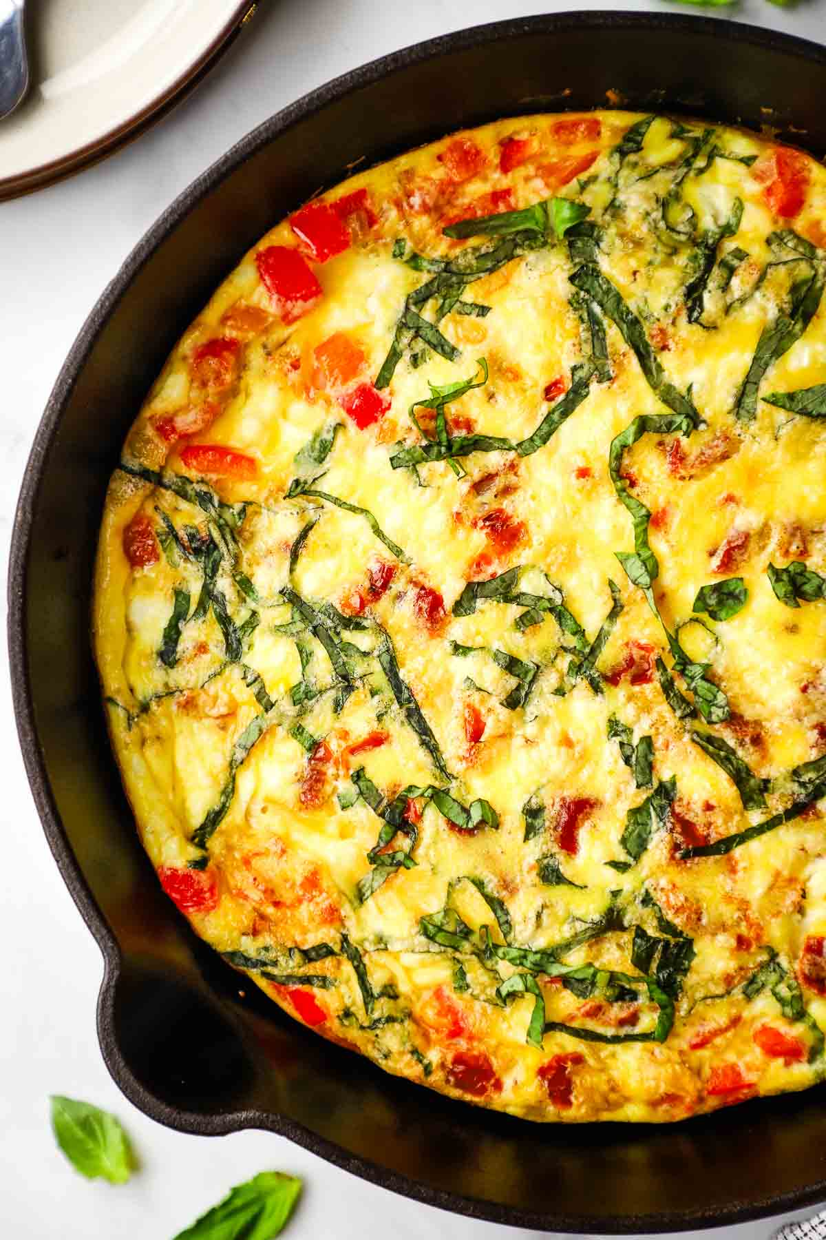 overhead view of a baked skillet of goat cheese frittata