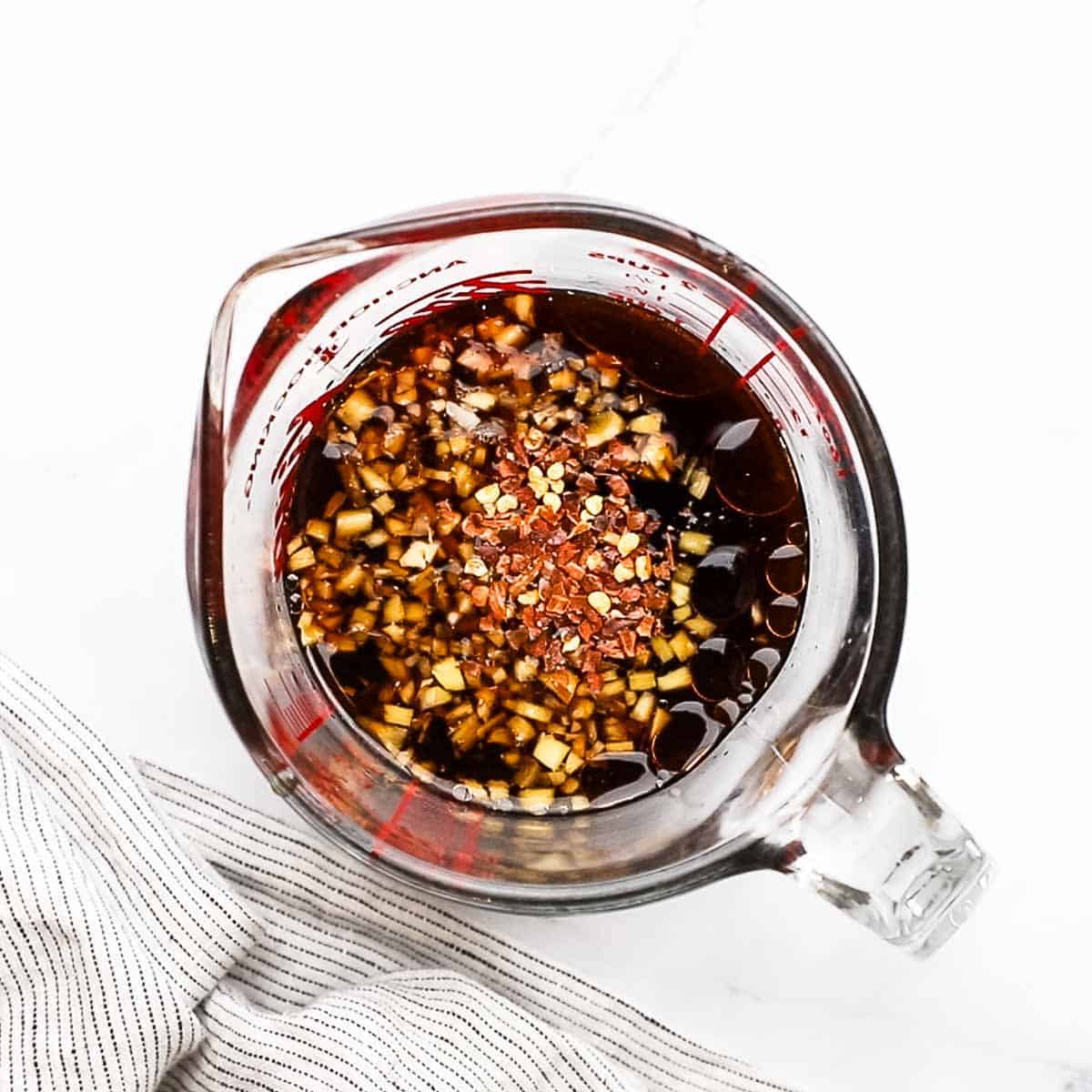 ingredients for pineapple teriyaki glaze in a measuring cup