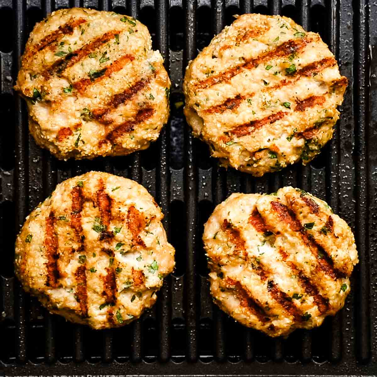 grilling chicken patties on a grill