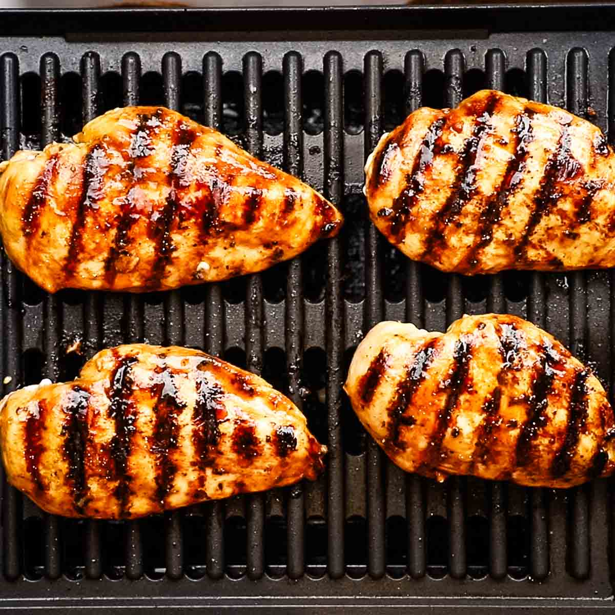 cooking balsamic chicken on a grill