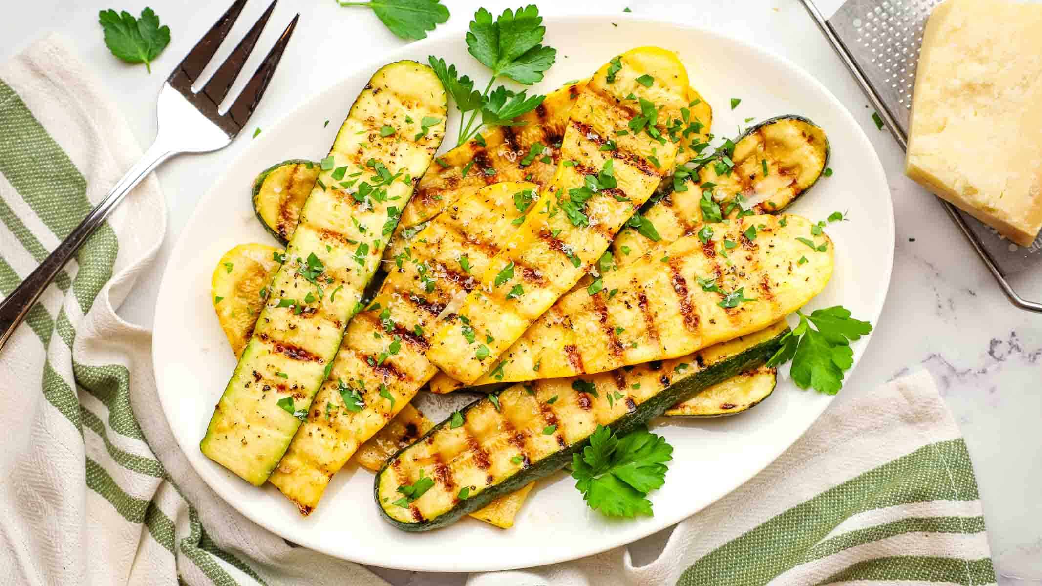 grilled zucchini and summer squash on a dish.
