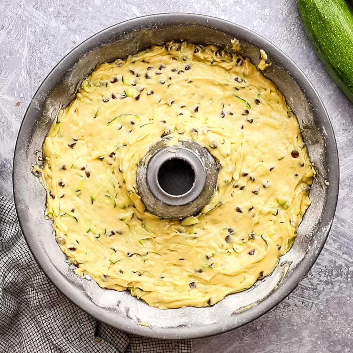 overhead view of raw cake batter in a bundt pan