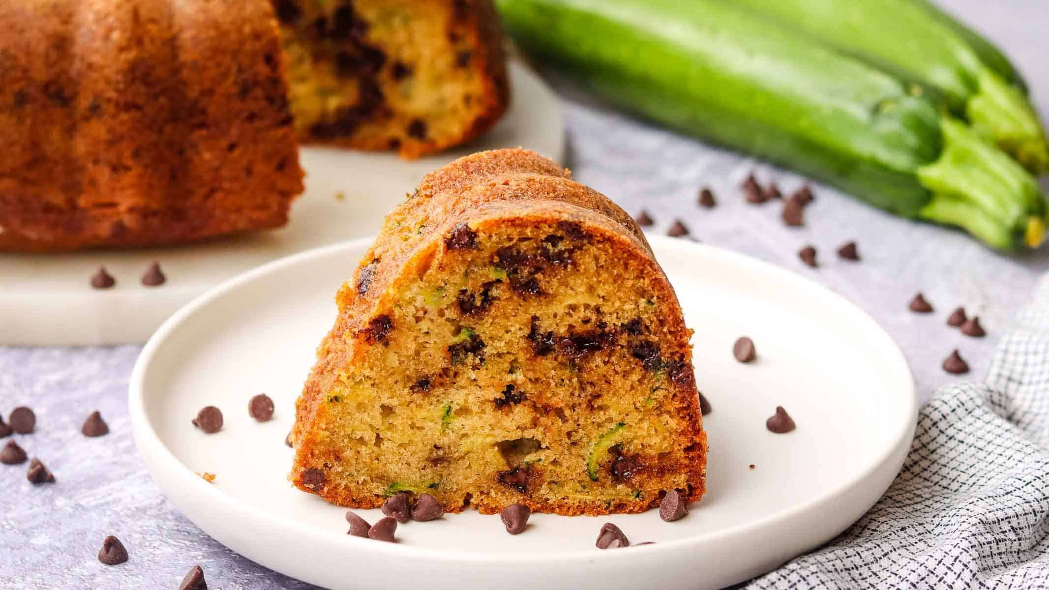 a slice of zucchini bundt cake on a plate